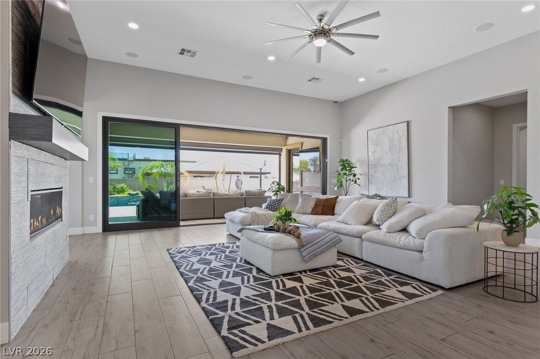 9841 W El Campo Grande Avenue, Las Vegas, NV 89149 Sliding glass doors extend the living space to the outdoors, perfect for entertaining.