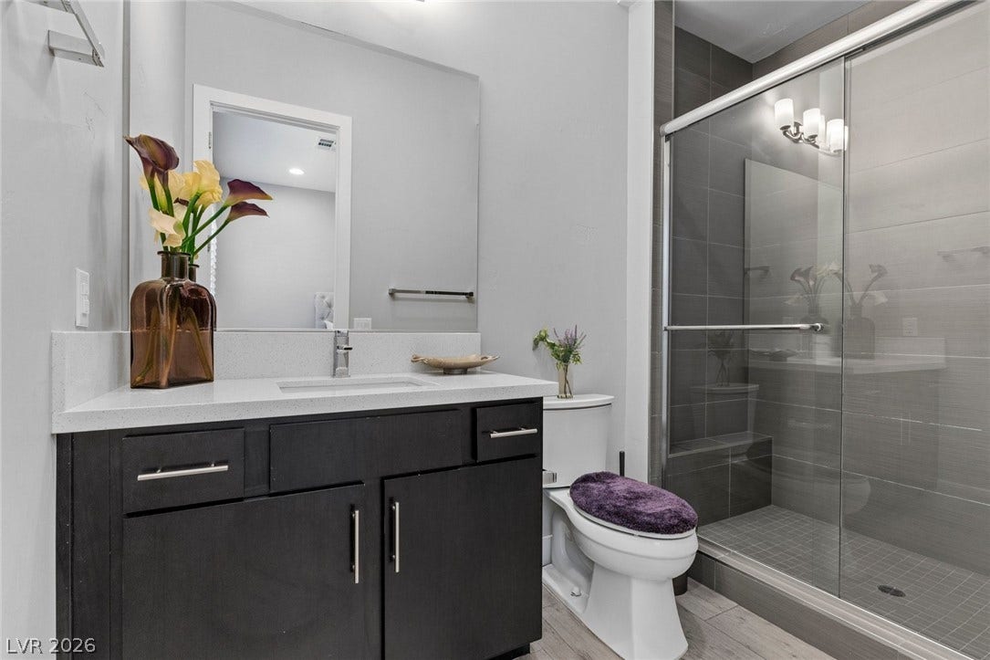 9841 W El Campo Grande Avenue, Las Vegas, NV 89149 A well-appointed bathroom with a spacious vanity and a modern tiled shower.