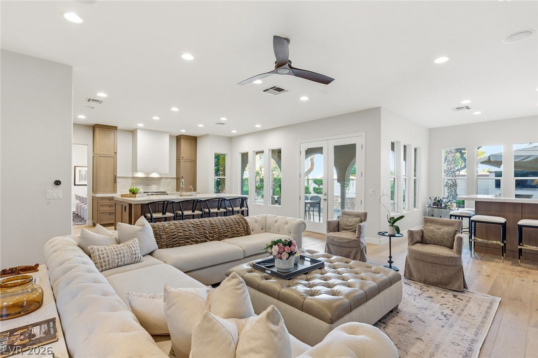 An open floorplan seamlessly connects the airy living area to the chef's kitchen.