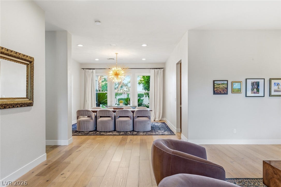 Gleaming hardwood floors flow throughout this open-concept layout leading into the dining area.