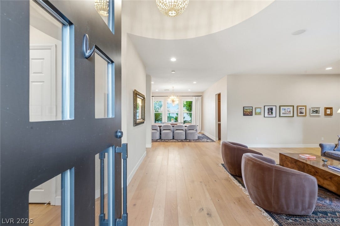 Smooth wood floors and high ceilings welcome guests into this light-filled modern home.