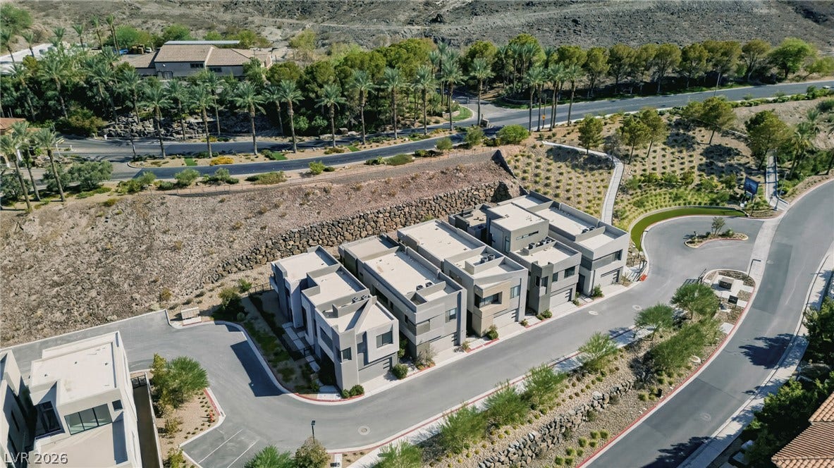 Striking modern architecture defines these multi-level homes nestled along a winding desert hillside.