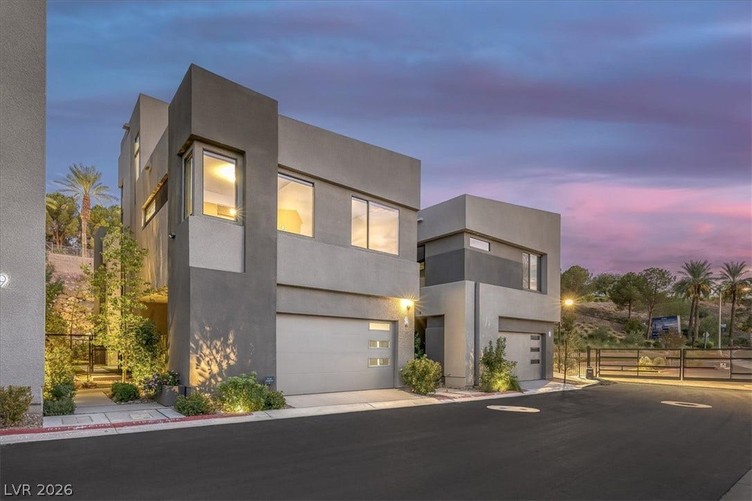 Bold contemporary lines and striking modern geometry define this architectural street-facing exterior.