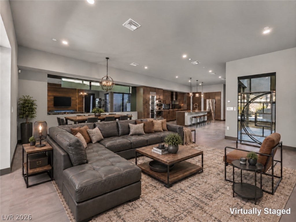 An open floorplan seamlessly connects the comfortable living area to the spacious kitchen.