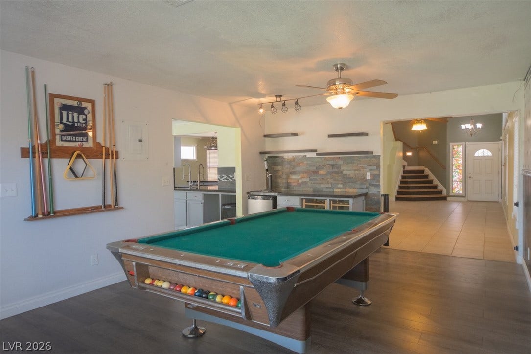 121 Heather Drive, Henderson, NV 89002 Gleaming wood floors anchor this versatile recreation room complete with a built-in wet bar.