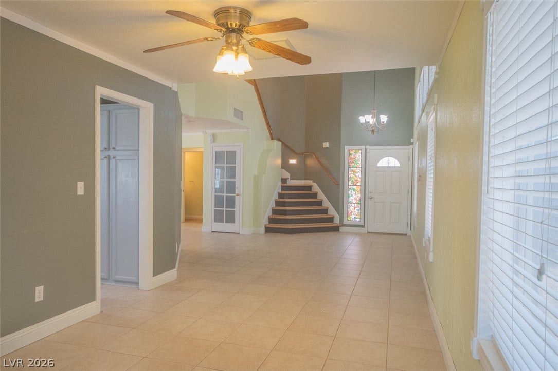 121 Heather Drive, Henderson, NV 89002 An open entryway showcases durable tile flooring, a grand staircase, and abundant natural light.