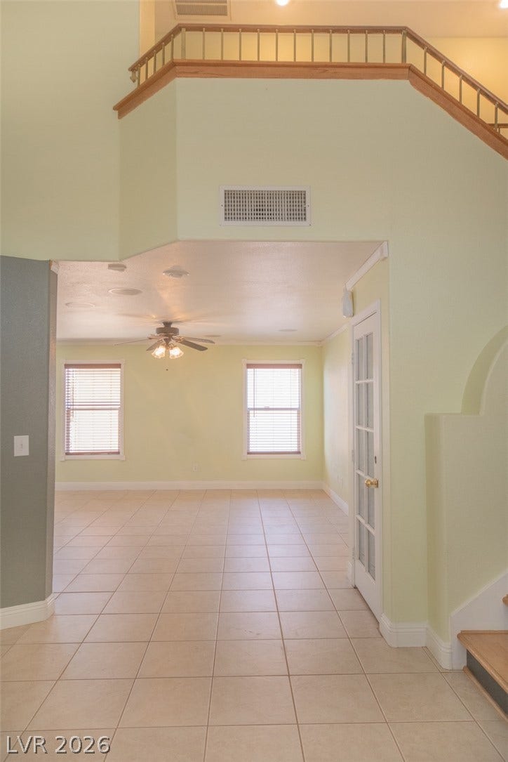 121 Heather Drive, Henderson, NV 89002 An open entryway connects directly to the tiled living area beneath soaring ceilings.