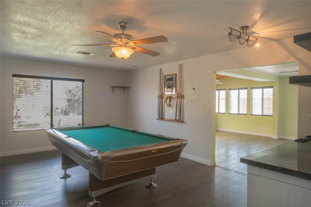 121 Heather Drive, Henderson, NV 89002 Hardwood floors and an open transition highlight this versatile recreation space.