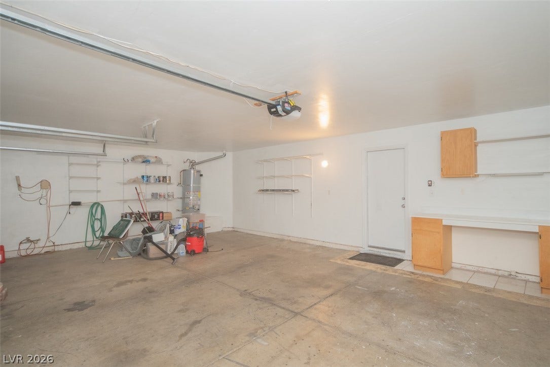 121 Heather Drive, Henderson, NV 89002 An accommodating multi-car garage provides extensive built-in storage shelves and a functional workspace area.