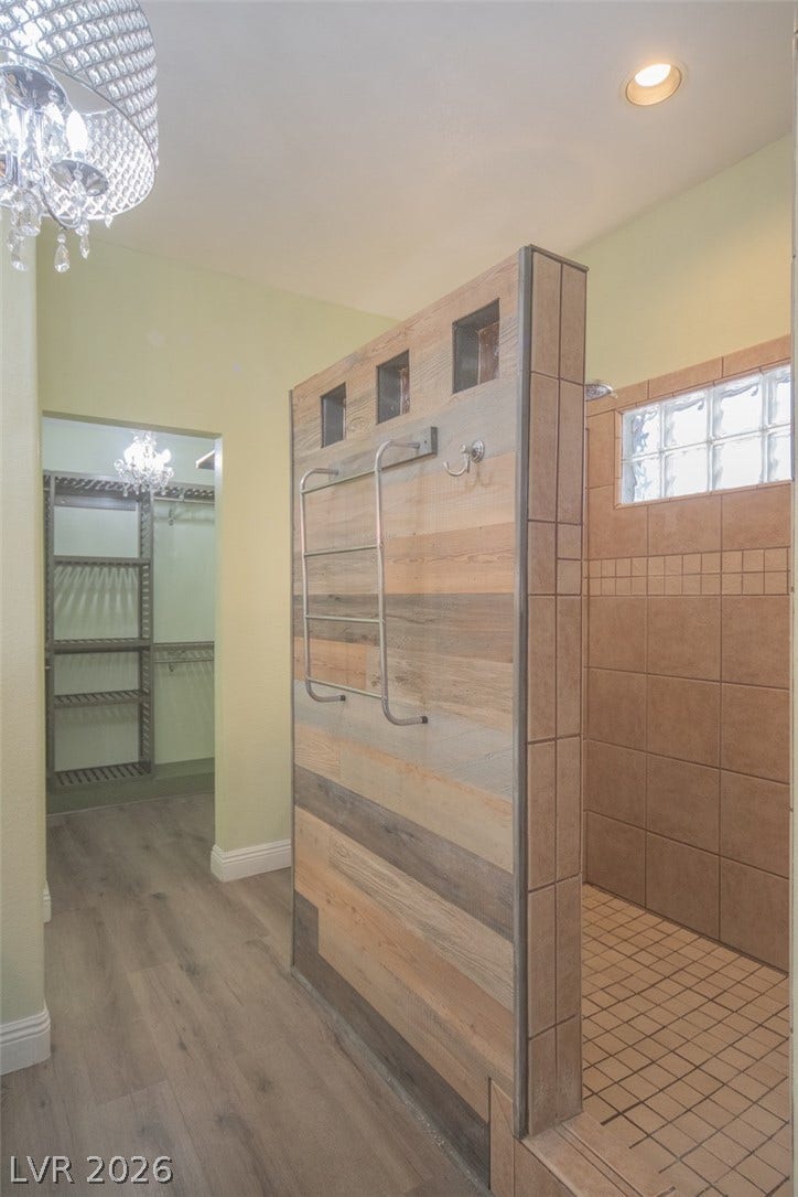 121 Heather Drive, Henderson, NV 89002 A walk-in tile shower sits adjacent to a spacious closet dressing area.