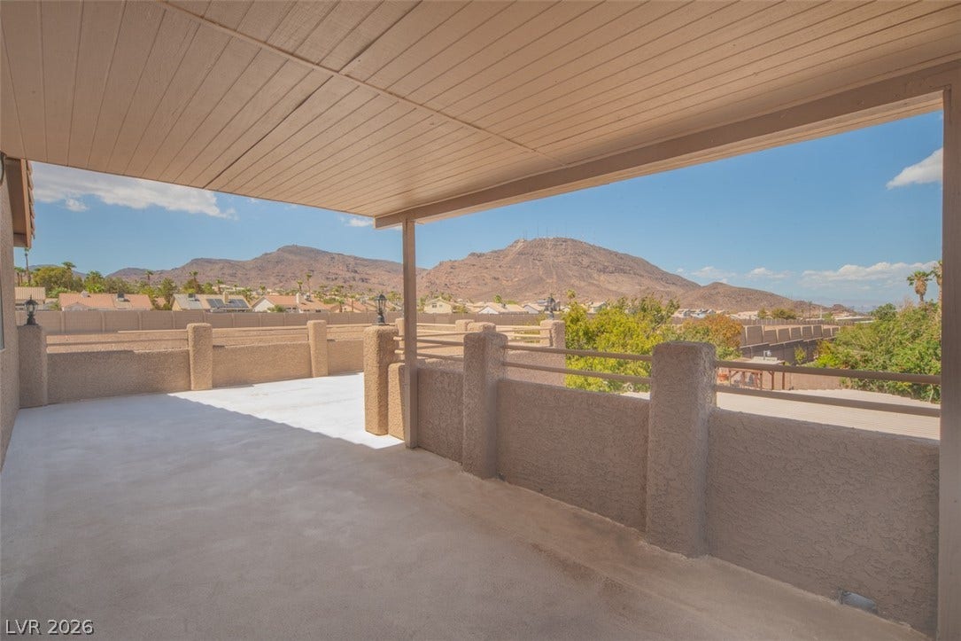 121 Heather Drive, Henderson, NV 89002 Panoramic mountain vistas frame this covered concrete terrace, providing an ideal outdoor retreat.