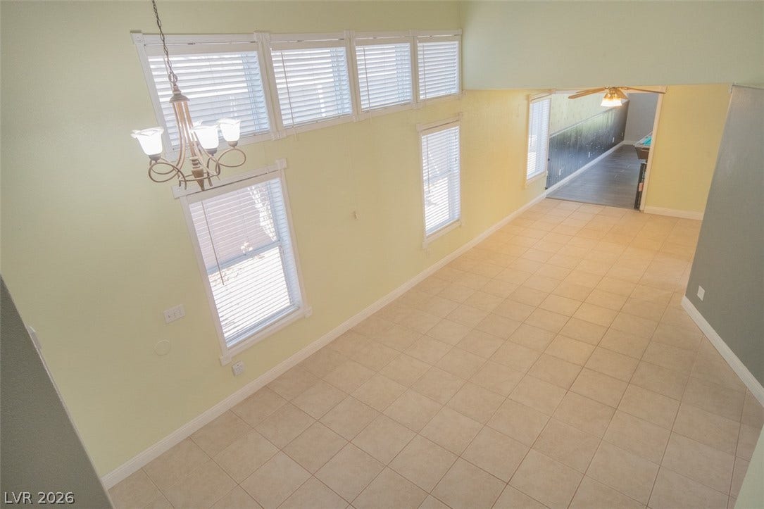 121 Heather Drive, Henderson, NV 89002 Gleaming tile floors and vaulted ceilings define this airy living space flooded with natural light.