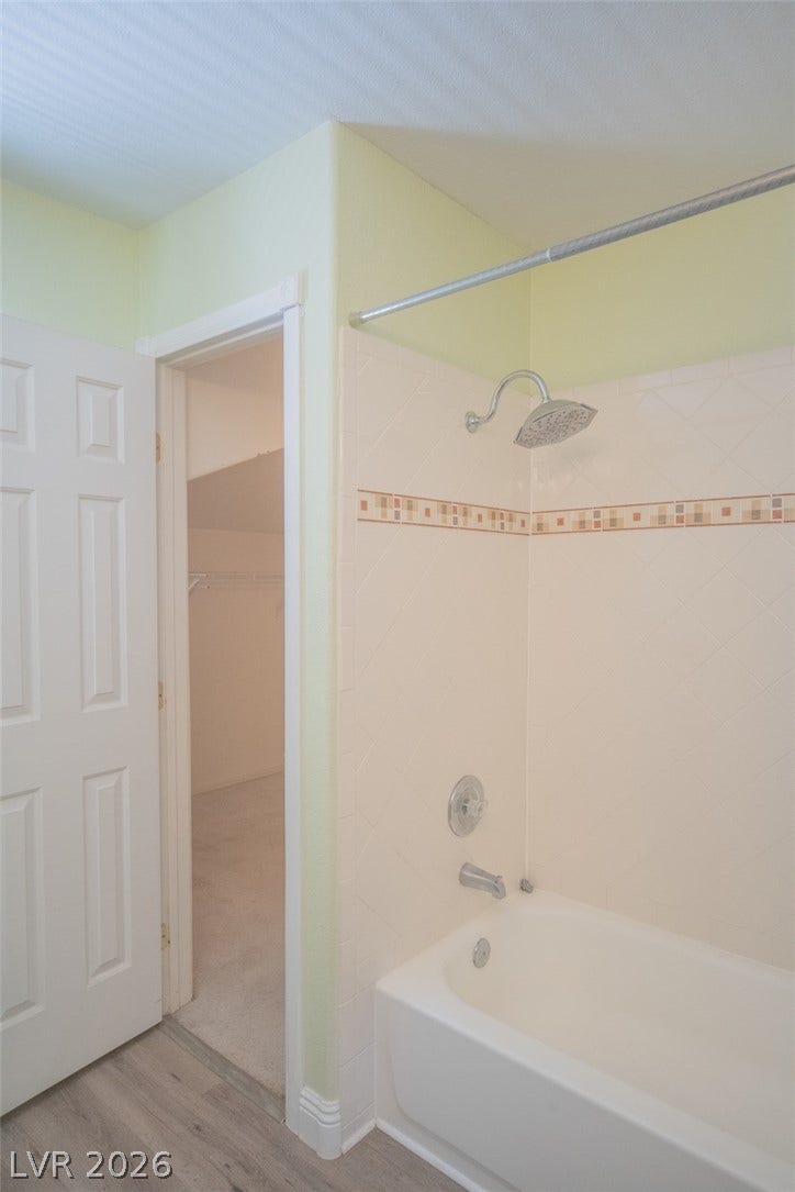 121 Heather Drive, Henderson, NV 89002 Crisp tiled surfaces and a modern shower fixture define this practical bath space.