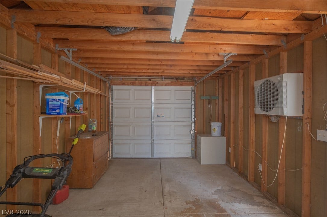 121 Heather Drive, Henderson, NV 89002 Exposed wood framing and concrete flooring define this functional, detached workspace structure.