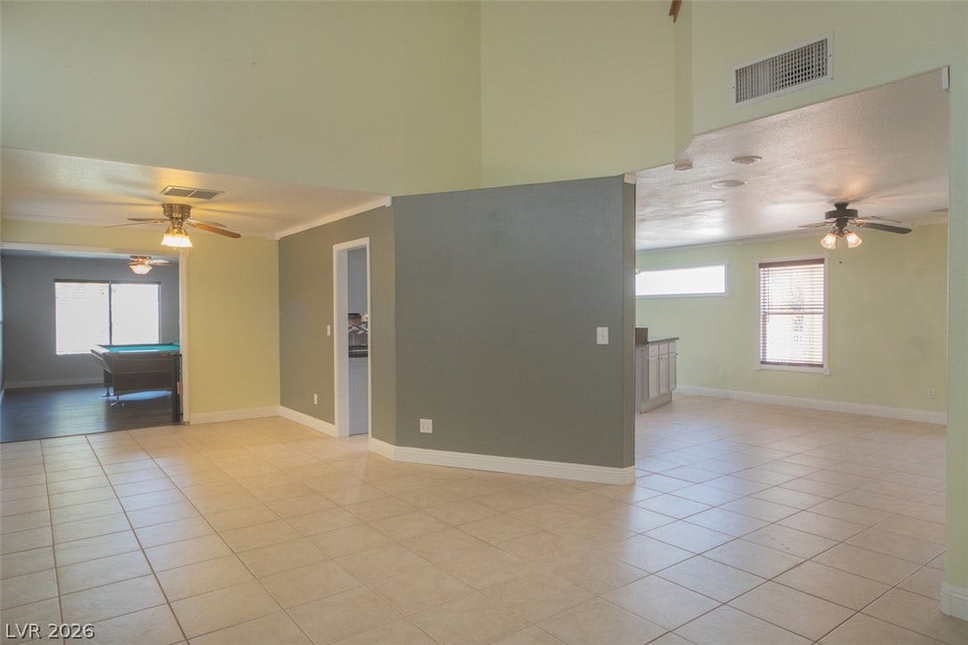 121 Heather Drive, Henderson, NV 89002 Polished tile flooring flows seamlessly through an airy, open layout with high ceilings.