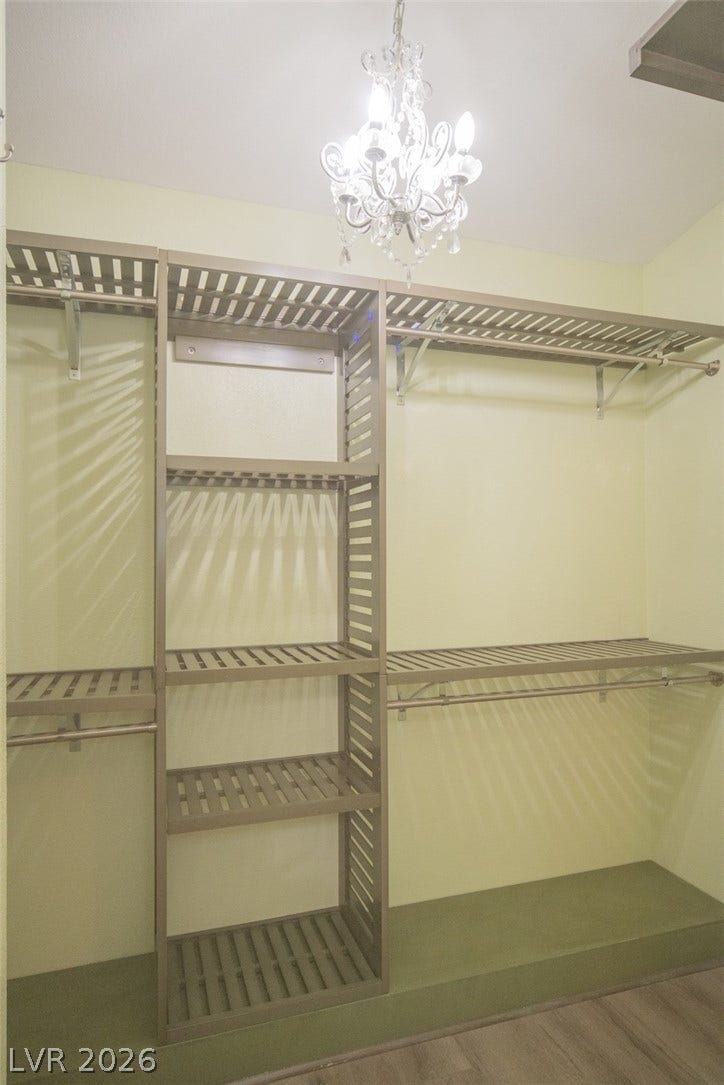 121 Heather Drive, Henderson, NV 89002 Organized shelving and a sparkling light fixture maximize storage in this functional wardrobe area.