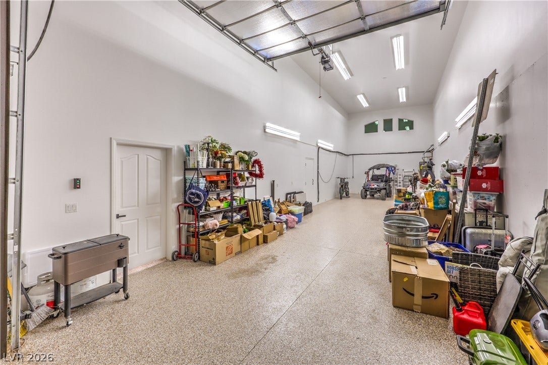 High ceilings and durable epoxy floors highlight this oversized storage and utility space.