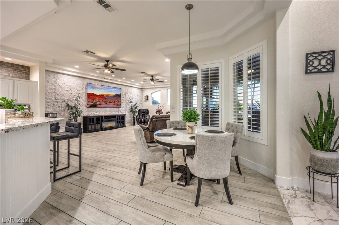 An open floorplan seamlessly connects the casual dining area with the living room.