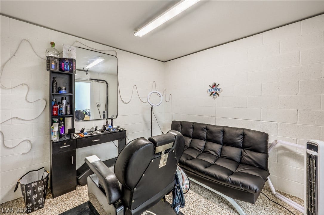Industrial block walls and epoxy flooring define this versatile multi-use basement space.
