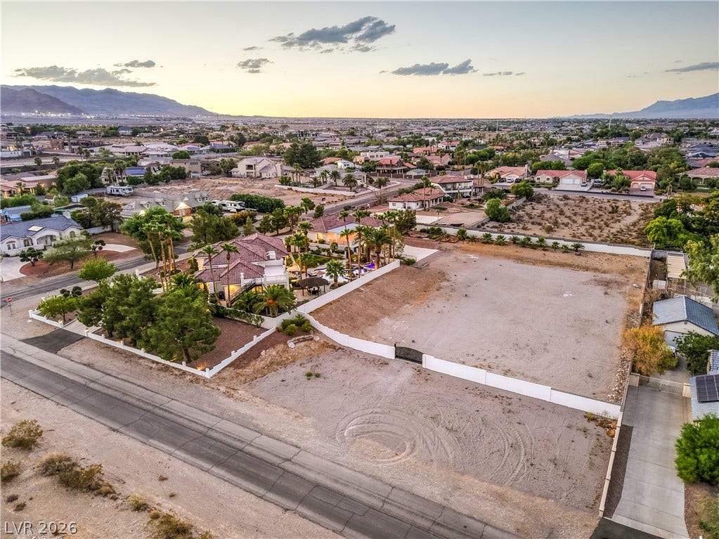 9390 Stange Avenue, Las Vegas, NV 89129 An expansive parcel of land offers tremendous potential alongside a fully developed neighborhood.