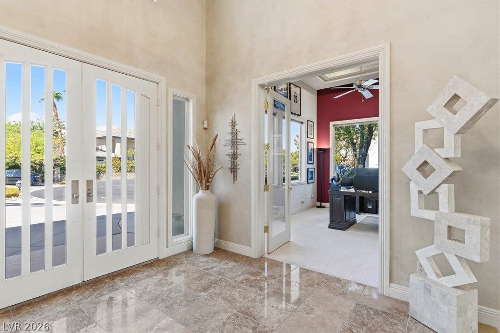 1632 Marbella Ridge Court, Las Vegas, NV 89117 Polished tile flooring and high ceilings establish an elegant entry into this light-filled home.