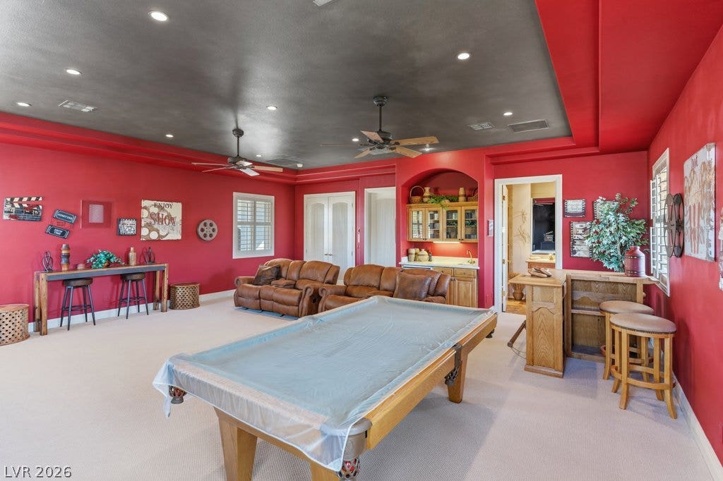 1632 Marbella Ridge Court, Las Vegas, NV 89117 A spacious recreation room showcases recessed lighting and carpet flooring.