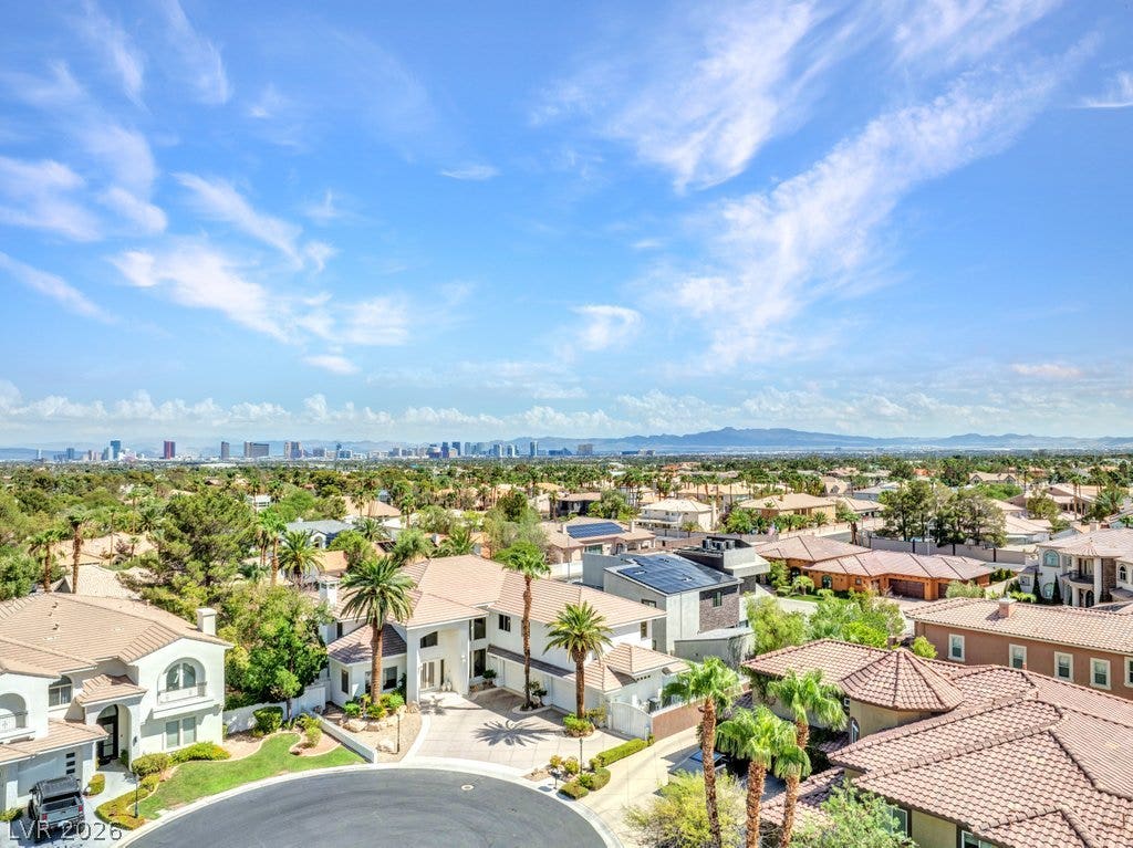 1632 Marbella Ridge Court, Las Vegas, NV 89117 Sweeping neighborhood views capture a distant skyline set against a backdrop of mountains.