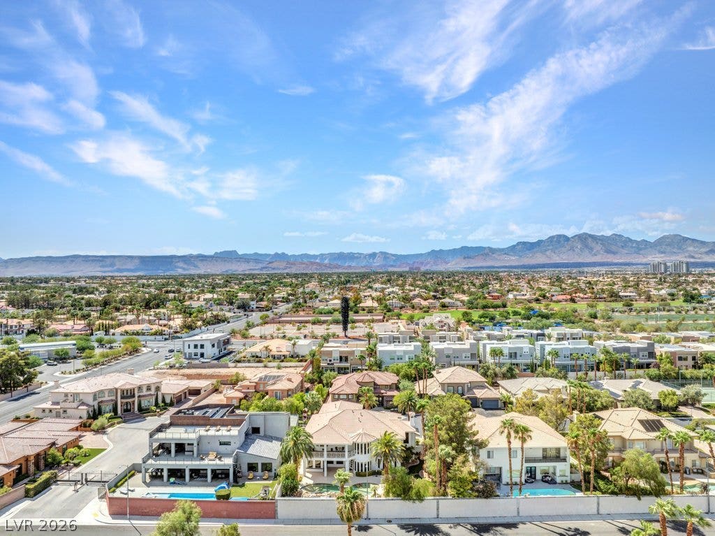 1632 Marbella Ridge Court, Las Vegas, NV 89117 Dramatic mountain backdrops frame this peaceful residential neighborhood under wide blue skies.
