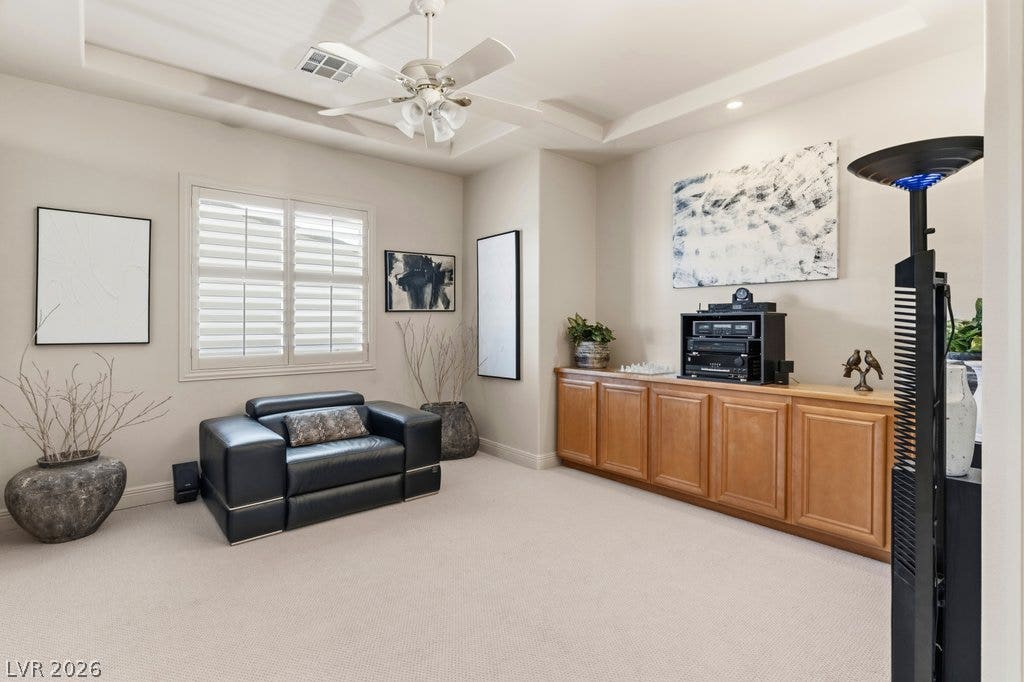 1632 Marbella Ridge Court, Las Vegas, NV 89117 A tray ceiling and built-in cabinetry elevate this versatile multi-purpose room.