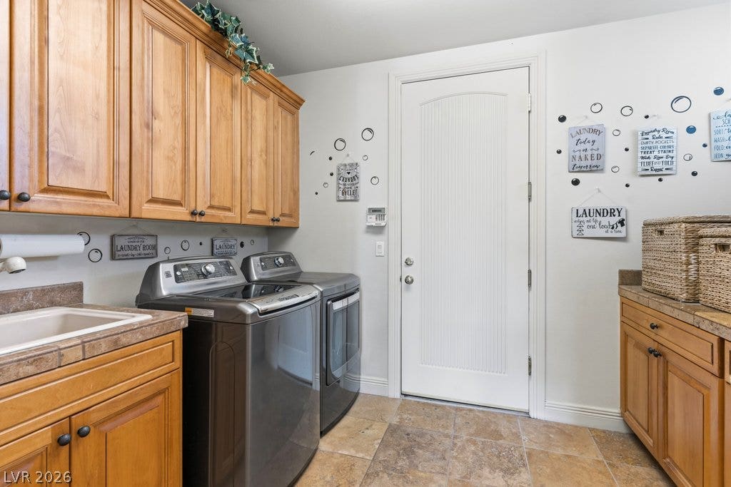 1632 Marbella Ridge Court, Las Vegas, NV 89117 A functional workspace with wood cabinetry and tile flooring completes the home utility area.