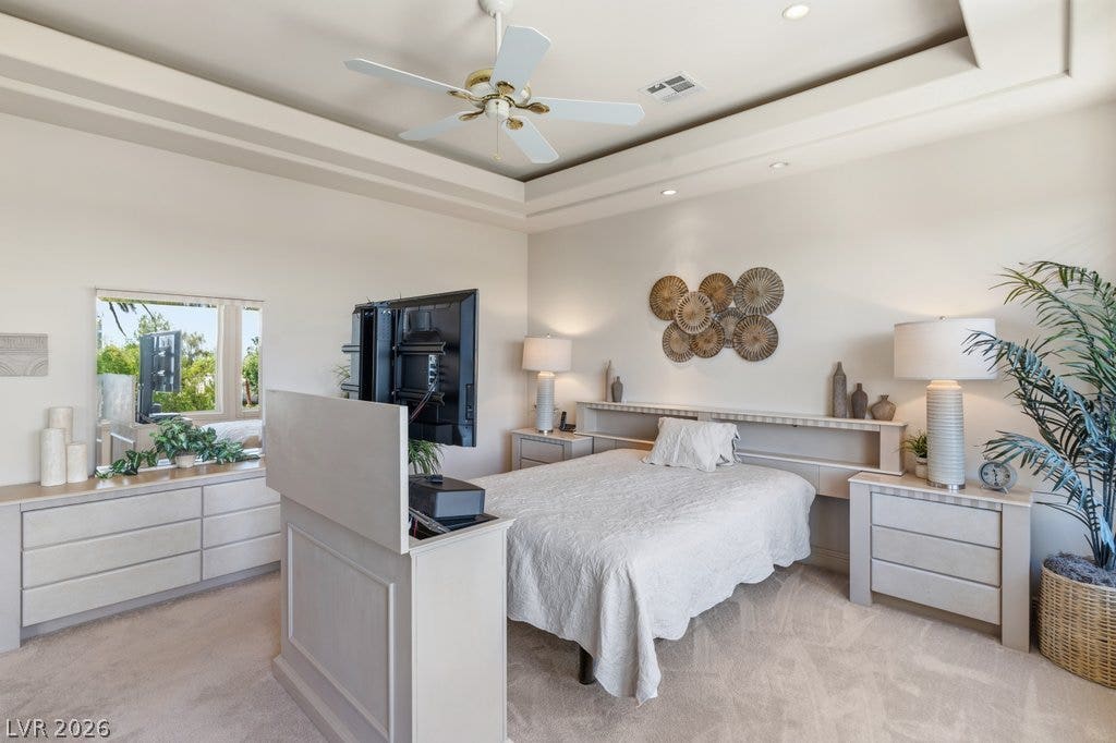 1632 Marbella Ridge Court, Las Vegas, NV 89117 An elegant tray ceiling with recessed lighting defines this comfortable bedroom retreat.
