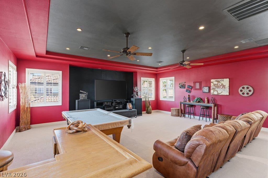 1632 Marbella Ridge Court, Las Vegas, NV 89117 Recessed lighting and a tray ceiling crown this spacious game room with carpeted flooring.