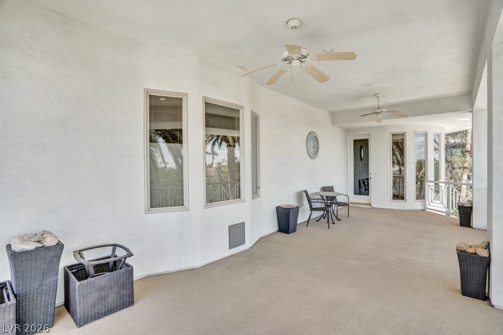 1632 Marbella Ridge Court, Las Vegas, NV 89117 Smooth stucco walls and concrete flooring define this covered outdoor patio space.