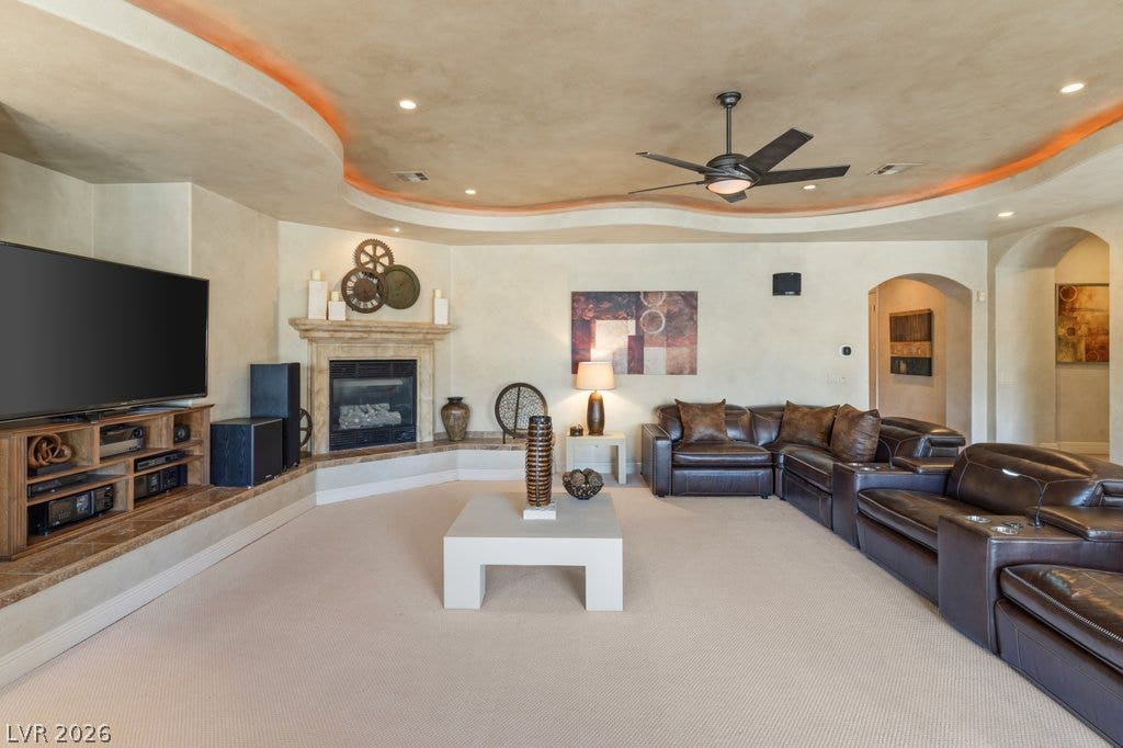 1632 Marbella Ridge Court, Las Vegas, NV 89117 Custom plaster walls and a curved tray ceiling define this inviting family room.