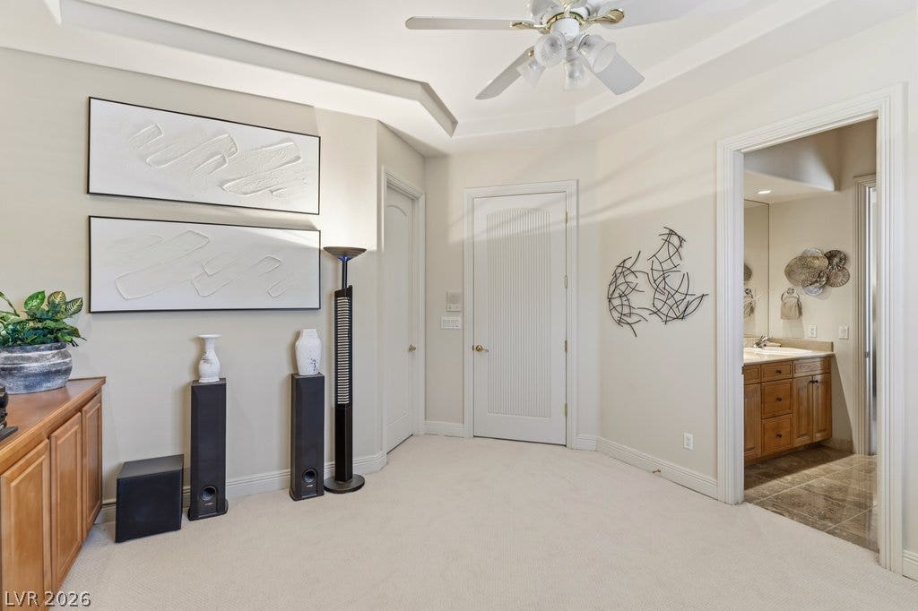 1632 Marbella Ridge Court, Las Vegas, NV 89117 An elegant tray ceiling and soft carpeting define this inviting transition space.