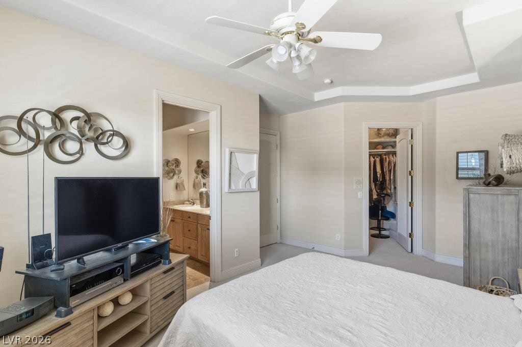 1632 Marbella Ridge Court, Las Vegas, NV 89117 An elegant tray ceiling and soft carpet define this comfortable primary bedroom suite.
