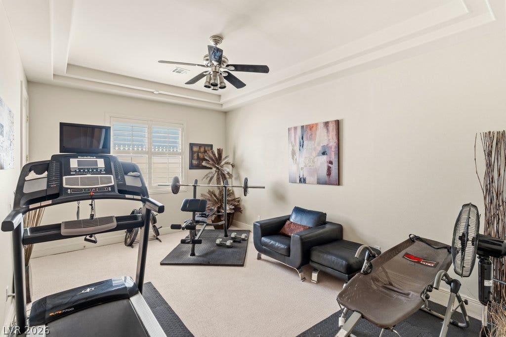 1632 Marbella Ridge Court, Las Vegas, NV 89117 Recessed ceiling details and plush carpeting create a comfortable environment for a home gym.