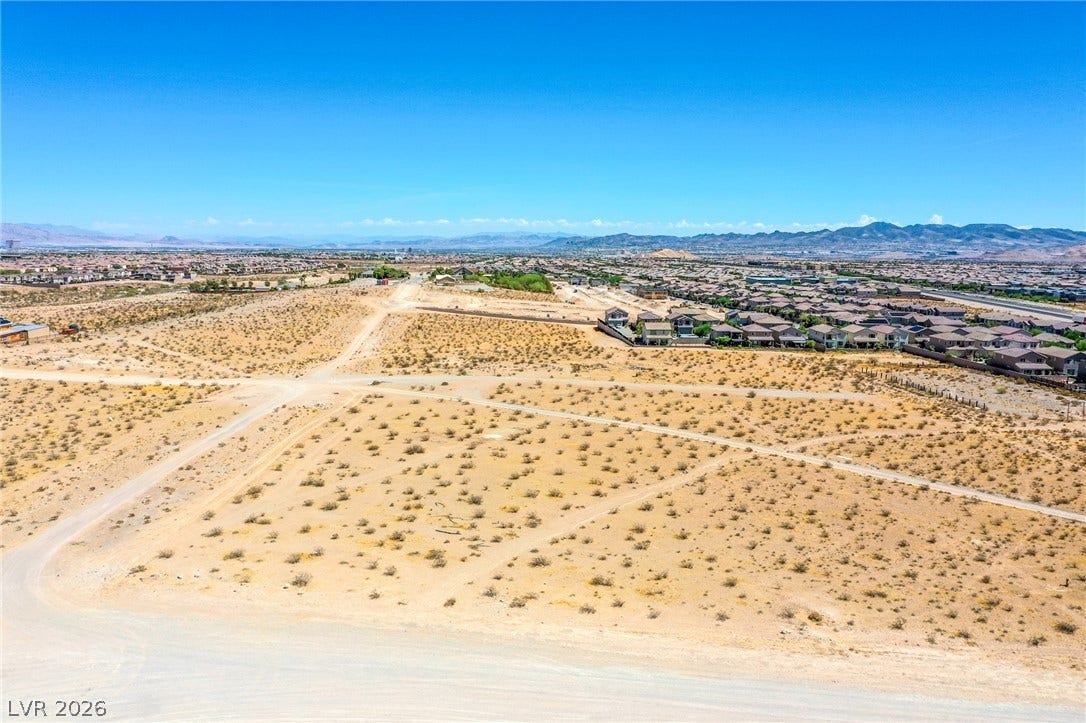 0 SE Corner of Hualapai & Pebble, Las Vegas, NV 89178 Distant mountains frame this vast desert lot bordering an established residential neighborhood.