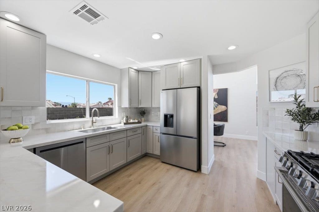 139 Skytop Drive, Henderson, NV 89015 Quartz countertops and new modern cabinetry define this elevated culinary space.