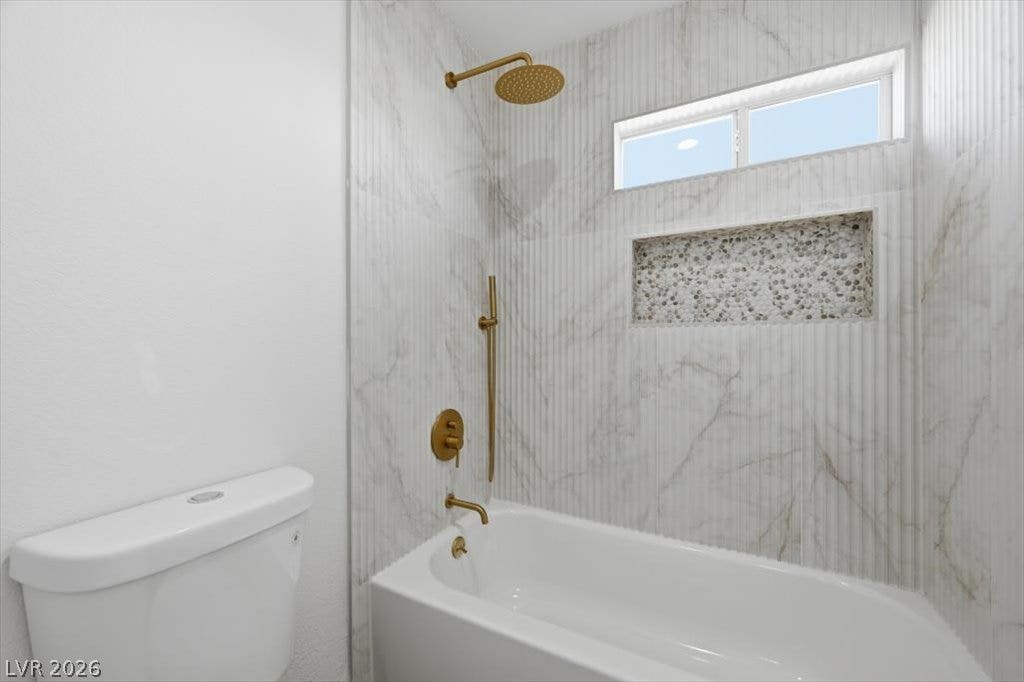 139 Skytop Drive, Henderson, NV 89015 Elegant fixtures accent the beautiful stone-patterned tile surrounding this soaking tub setup.