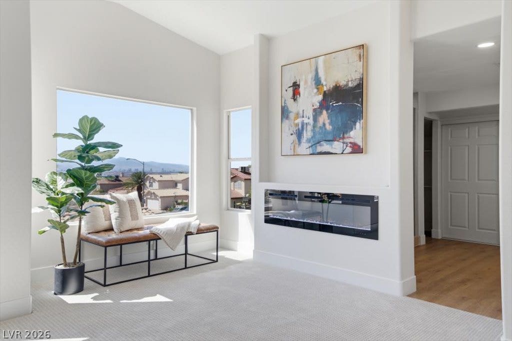 139 Skytop Drive, Henderson, NV 89015 Large picture windows frame incredible Strip views in this light-filled room.