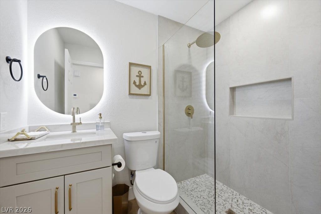 139 Skytop Drive, Henderson, NV 89015 A modern downstairs bathroom boasts an elegant tile-finished shower.