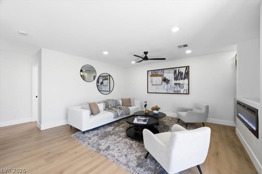 139 Skytop Drive, Henderson, NV 89015 A bright, inviting family room featuring custom built-ins and a sleek contemporary fireplace.