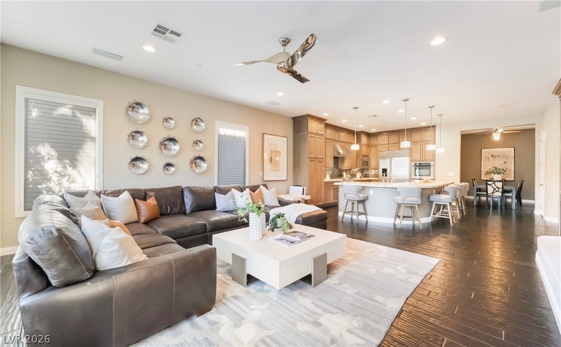 1343 Quiet River Avenue, Henderson, NV 89012 Gleaming hardwood floors run through this airy, open-concept living area and modern kitchen.