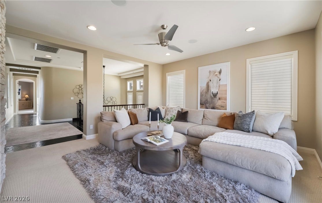 1343 Quiet River Avenue, Henderson, NV 89012 An open floor plan connects this comfortable living space to adjacent home hallways.