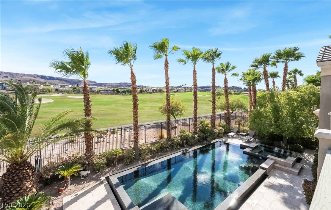 1343 Quiet River Avenue, Henderson, NV 89012 An inviting backyard oasis borders a lush golf course under expansive desert skies.