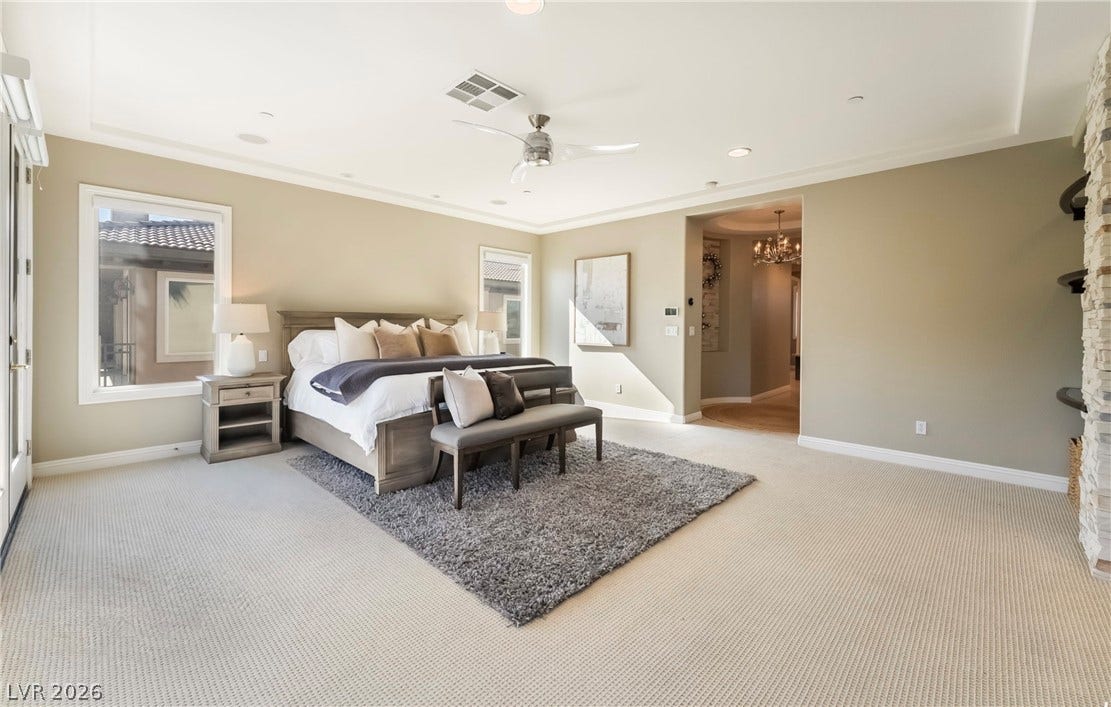 1343 Quiet River Avenue, Henderson, NV 89012 Recessed lighting and detailed trimwork enhance this generous main-floor bedroom suite.