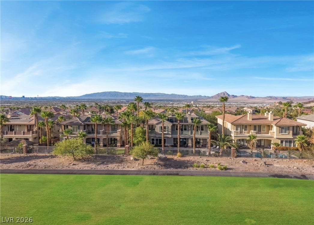 1343 Quiet River Avenue, Henderson, NV 89012 Distant mountain ranges and a lush golf course green frame this scenic desert neighborhood.