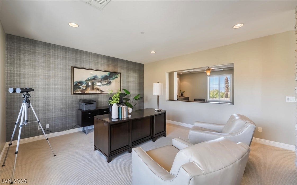 1343 Quiet River Avenue, Henderson, NV 89012 Recessed lighting and custom wall treatments anchor this versatile home workspace.