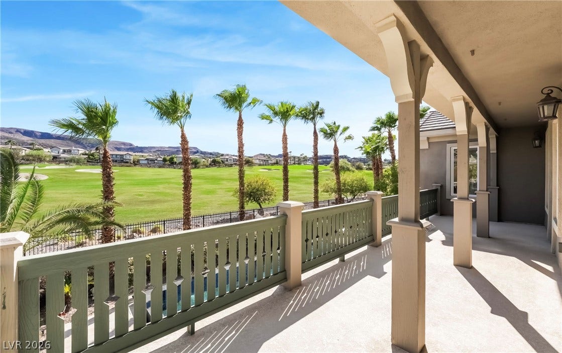 1343 Quiet River Avenue, Henderson, NV 89012 Lush fairways and distant mountains frame the view from this covered upper-level balcony.